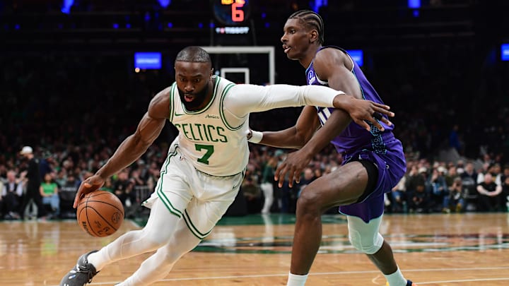 Mar 4, 2026; Boston, Massachusetts, USA;  Boston Celtics guard Jaylen Brown (7) controls the ball while Charlotte Hornets forward Moussa Diabate (14) defends during the first half at TD Garden. Mandatory Credit: Bob DeChiara-Imagn Images