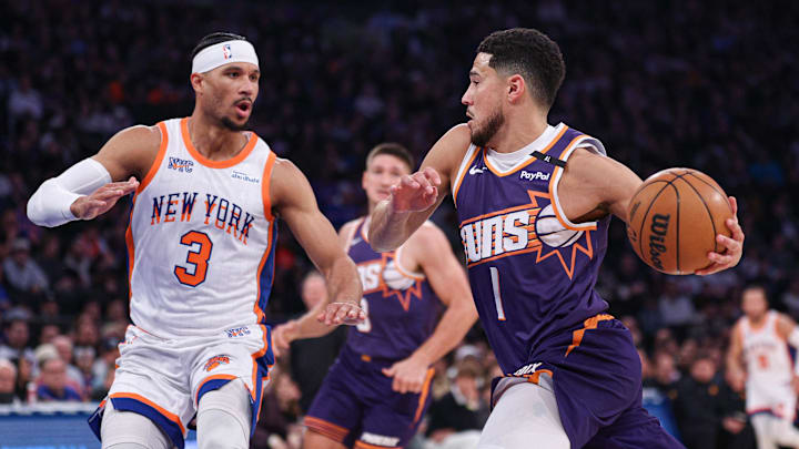 Phoenix Suns guard Devin Booker goes to the basket against New York Knicks guard Josh Hart. Mandatory Credit: Vincent Carchietta-Imagn Images Phoenix Suns guard Devin Booker goes to the basket against New York Knicks guard Josh Hart. Mandatory Credit: Vincent Carchietta-Imagn Images