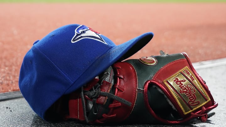 Apr 16, 2024; Toronto, Ontario, CAN; A Toronto Blue Jays hat and glove before the start of the game Apr 16, 2024; Toronto, Ontario, CAN; A Toronto Blue Jays hat and glove before the start of the game