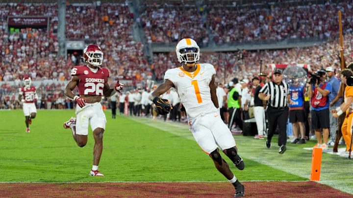 Tennessee Volunteers wide receiver Dont'e Thornton Jr. (1) scores a touchdown in front of Oklahoma Sooners defensive back Kani Walker (26) during a college football game between the University of Oklahoma Sooners (OU) and the Tennessee Volunteers at Gaylord Family - Oklahoma Memorial Stadium in Norman, Okla., Saturday, Sept. 21, 2024.