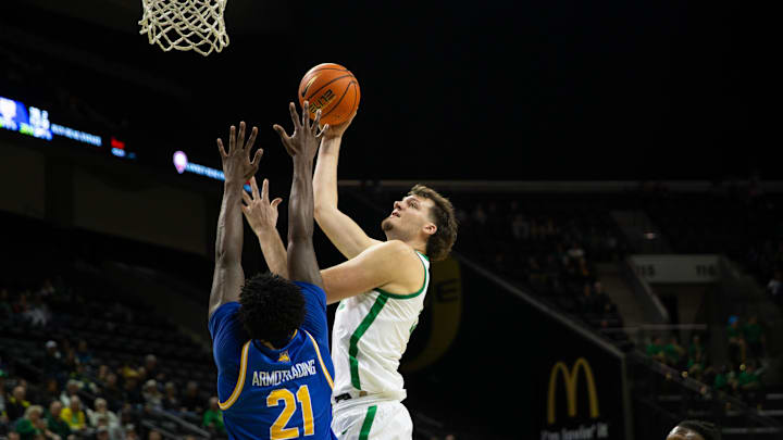 Oregon's Nate Bittle, right, goes up for a shot against UC Riverside’s Joel Armotrading during the second half at Matthew Knight Arena in Eugene.