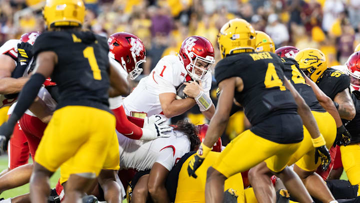 Oct 25, 2025; Tempe, Arizona, USA; Houston Cougars quarterback Conner Weigman (1) dives into the end zone for a touchdown against the Arizona State Sun Devils in the first half at Mountain America Stadium. Mandatory Credit: Mark J. Rebilas-Imagn Images