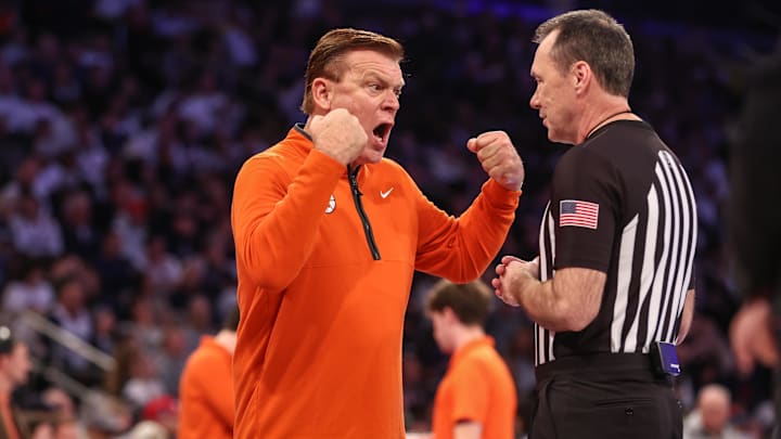 Nov 28, 2025; New York, New York, USA; Illinois Fighting Illini head coach Brad Underwood talks with an official in the first half against the UConn Huskies at Madison Square Garden. Mandatory Credit: Wendell Cruz-Imagn Images