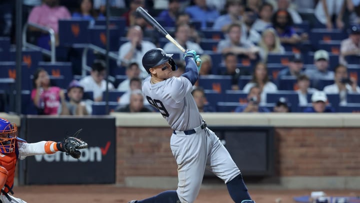 Jun 25, 2024; New York City, New York, USA; New York Yankees center fielder Aaron Judge (99) follows through on a grand slam home run during the eighth inning against the New York Mets at Citi Field. Mandatory Credit: Brad Penner-USA TODAY Sports