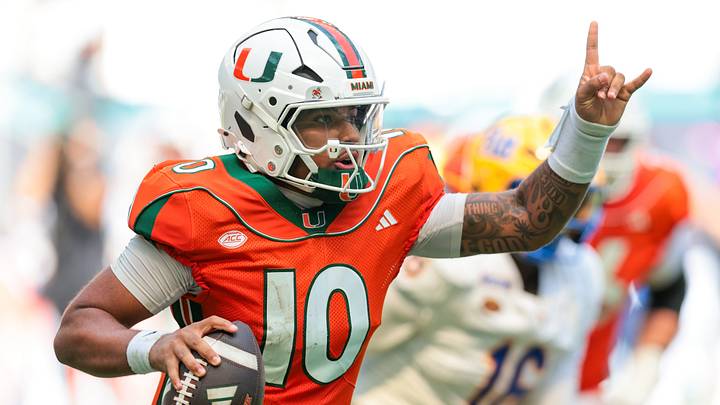 Oct 24, 2026; Miami Gardens, Florida, USA; Miami Hurricanes quarterback Darian Mensah (10) runs with the football against the Pittsburgh Panthers during the third quarter at Hard Rock Stadium. Mandatory Credit: Sam Navarro-Imagn Images