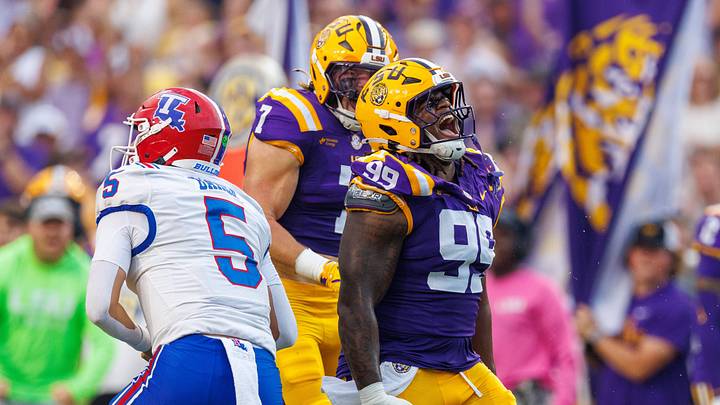 Sep 12, 2026; Baton Rouge, Louisiana, USA;  LSU Tigers defensive tackle Deuce Geralds (99) reacts to sacking Louisiana Tech Bulldogs quarterback Blake Baker (5) during the first half at Tiger Stadium.  Mandatory Credit: Stephen Lew-Imagn Images