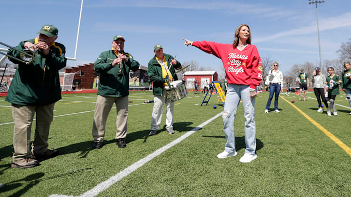 Randi Martin, mother of Kansas City Chiefs quarterback Patrick Mahomes, interacts with the Green Bay Packers Tailgaters Band during Field Fest on April 23, 2025, at City Stadium in Green Bay, Wis. The event was organized by the city of Green Bay and Greater Green Bay YMCA to celebrate NFL draft week.