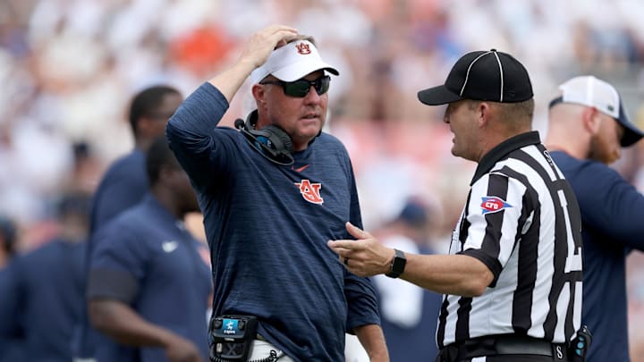 Sep 13, 2025; Auburn, Alabama, USA; Auburn Tigers head coach Hugh Freeze talks with a game official during the third quarter against the South Alabama Jaguars at Jordan-Hare Stadium. Mandatory Credit: John Reed-Imagn Images