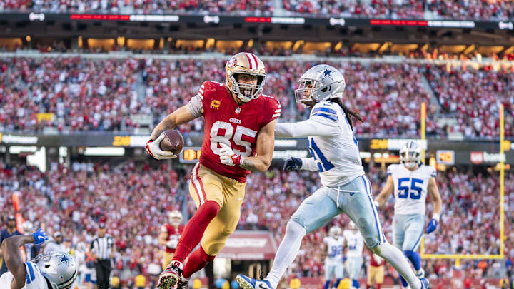 October 8, 2023; Santa Clara, California, USA; San Francisco 49ers tight end George Kittle (85) scores a touchdown against Dallas Cowboys cornerback Jourdan Lewis (2) and cornerback Stephon Gilmore (21) during the second quarter at Levi's Stadium. Mandatory Credit: Kyle Terada-Imagn Images October 8, 2023; Santa Clara, California, USA; San Francisco 49ers tight end George Kittle (85) scores a touchdown against Dallas Cowboys cornerback Jourdan Lewis (2) and cornerback Stephon Gilmore (21) during the second quarter at Levi's Stadium. Mandatory Credit: Kyle Terada-Imagn Images