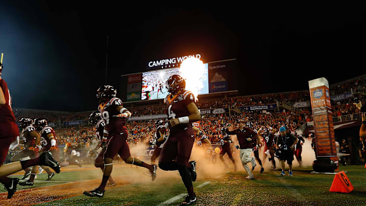 Dec 3, 2016; Orlando, Fla.; Virginia Tech quarterback Jerod Evans (4)  and teammates run out of the tunnel before the ACC title game vs. Clemson.