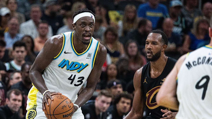 May 11, 2025; Indianapolis, Indiana, USA; Indiana Pacers forward Pascal Siakam (43) holds the ball while Cleveland Cavaliers forward Evan Mobley (4) defends during game four of the second round for the 2025 NBA Playoffs at Gainbridge Fieldhouse. Mandatory Credit: Trevor Ruszkowski-Imagn Images
