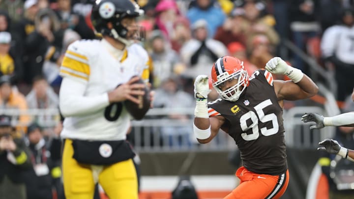 Dec 28, 2025; Cleveland, Ohio, USA;  Cleveland Browns defensive end Myles Garrett (95) breaks a tackle in the first quarter against the Pittsburgh Steelers at Huntington Bank Field. Mandatory Credit: Scott Galvin-Imagn Images