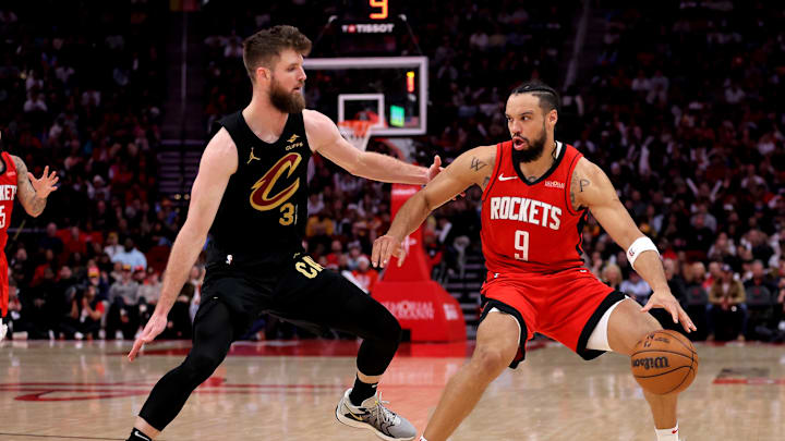 Jan 22, 2025; Houston, Texas, USA; Houston Rockets forward Dillon Brooks (9) handle the ball against Cleveland Cavaliers forward Dean Wade (32) during the fourth quarter at Toyota Center. Mandatory Credit: Erik Williams-Imagn Images