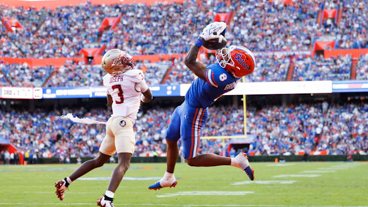Nov 29, 2025; Gainesville, Florida, USA; Florida Gators wide receiver Vernell Brown III (8) attempts to make a catch over Florida State Seminoles defensive back Edwin Joseph (3) during the first half at Ben Hill Griffin Stadium. Mandatory Credit: Matt Pendleton-Imagn Images Nov 29, 2025; Gainesville, Florida, USA; Florida Gators wide receiver Vernell Brown III (8) attempts to make a catch over Florida State Seminoles defensive back Edwin Joseph (3) during the first half at Ben Hill Griffin Stadium. Mandatory Credit: Matt Pendleton-Imagn Images