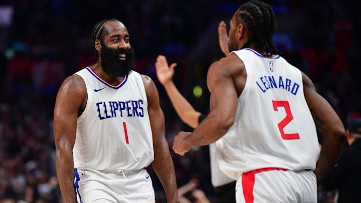 Jan 21, 2024; Los Angeles, California, USA; Los Angeles Clippers guard James Harden (1) reacts after forward Kawhi Leonard (2) scores three point basket against the Brooklyn Nets during the second half at Crypto.com Arena. Mandatory Credit: Gary A. Vasquez-Imagn Images