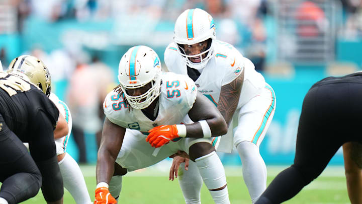 Miami Dolphins quarterback Tua Tagovailoa (1) under center Aaron Brewer (55) against the New Orleans Saints during the first half at Hard Rock Stadium. 