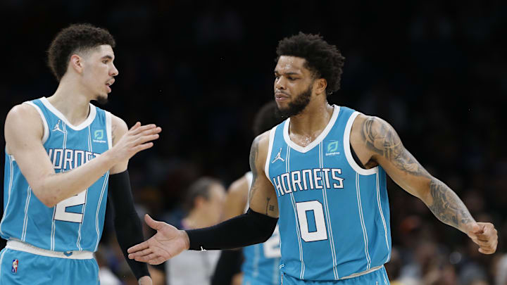 Mar 14, 2022; Oklahoma City, Oklahoma, USA; Charlotte Hornets guard LaMelo Ball (2) and forward Miles Bridges (0) celebrate between plays against the Oklahoma City Thunder during the second half at Paycom Center. Charlotte won 134-116. Mandatory Credit: Alonzo Adams-Imagn Images Mar 14, 2022; Oklahoma City, Oklahoma, USA; Charlotte Hornets guard LaMelo Ball (2) and forward Miles Bridges (0) celebrate between plays against the Oklahoma City Thunder during the second half at Paycom Center. Charlotte won 134-116. Mandatory Credit: Alonzo Adams-Imagn Images