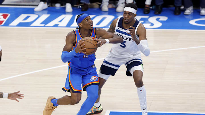 Oklahoma City Thunder guard Shai Gilgeous-Alexander (2) drives against Minnesota Timberwolves forward Jaden McDaniels (3) in the fourth quarter during game two of the western conference finals for the 2025 NBA Playoffs at Paycom Center on May 22. Oklahoma City Thunder guard Shai Gilgeous-Alexander (2) drives against Minnesota Timberwolves forward Jaden McDaniels (3) in the fourth quarter during game two of the western conference finals for the 2025 NBA Playoffs at Paycom Center on May 22.