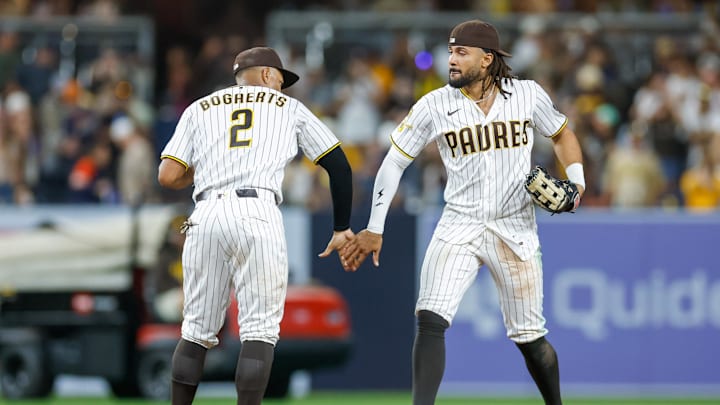 Mar 28, 2026; San Diego, California, USA; San Diego Padres right fielder Fernando Tatis Jr. (23) with shortstop Xander Bogaerts (2) after defeating the Detroit Tigers at Petco Park. Mandatory Credit: David Frerker-Imagn Images