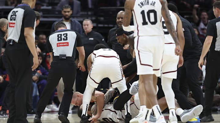Mar 12, 2025; Houston, Texas, USA; Phoenix Suns center Mason Plumlee (22) and Houston Rockets center Steven Adams (12) have a physical altercation during the first half of the game at Toyota Center. Mandatory Credit: Troy Taormina-Imagn Images