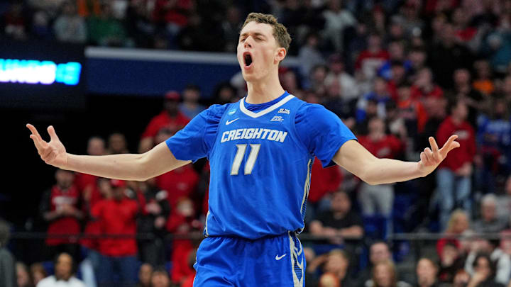 Mar 20, 2025; Lexington, KY, USA; Creighton Bluejays center Ryan Kalkbrenner (11) celebrate after making a three pointer during the second half against the Louisville Cardinals in the first round of the NCAA Tournament at Rupp Arena. Mandatory Credit: Aaron Doster-Imagn Images