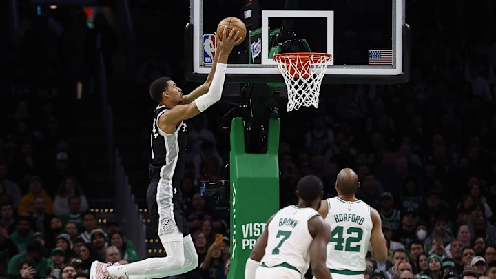 Jan 17, 2024; Boston, Massachusetts, USA; San Antonio Spurs center Victor Wembanyama (1) goes up to dunk as Boston Celtics guard Jaylen Brown (7) and center Al Horford (42) look on during the first quarter at TD Garden. Mandatory Credit: Winslow Townson-Imagn Images