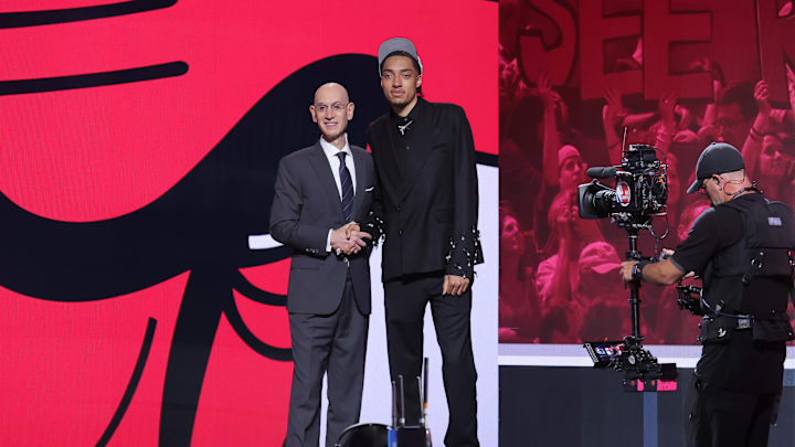 Jun 25, 2025; Brooklyn, NY, USA; Noa Essengue stands with NBA commissioner Adam Silver after being selected as the 12th pick by the Chicago Bulls in the first round of the 2025 NBA Draft at Barclays Center. Mandatory Credit: Brad Penner-Imagn Images Jun 25, 2025; Brooklyn, NY, USA; Noa Essengue stands with NBA commissioner Adam Silver after being selected as the 12th pick by the Chicago Bulls in the first round of the 2025 NBA Draft at Barclays Center. Mandatory Credit: Brad Penner-Imagn Images