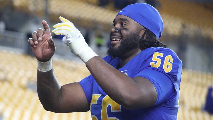 Oct 25, 2025; Pittsburgh, Pennsylvania, USA; Pittsburgh Panthers offensive lineman Lyndon Cooper (56) leads the band in the victory song after defeating the North Carolina State Wolfpack at Acrisure Stadium. Mandatory Credit: Charles LeClaire-Imagn Images Oct 25, 2025; Pittsburgh, Pennsylvania, USA; Pittsburgh Panthers offensive lineman Lyndon Cooper (56) leads the band in the victory song after defeating the North Carolina State Wolfpack at Acrisure Stadium. Mandatory Credit: Charles LeClaire-Imagn Images