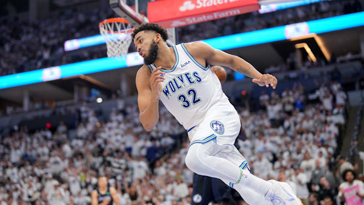 May 24, 2024; Minneapolis, Minnesota, USA; Minnesota Timberwolves center Karl-Anthony Towns (32) reacts after a play against the Dallas Mavericks in the second quarter during game two of the western conference finals for the 2024 NBA playoffs at Target Center. Mandatory Credit: Brad Rempel-Imagn Images May 24, 2024; Minneapolis, Minnesota, USA; Minnesota Timberwolves center Karl-Anthony Towns (32) reacts after a play against the Dallas Mavericks in the second quarter during game two of the western conference finals for the 2024 NBA playoffs at Target Center. Mandatory Credit: Brad Rempel-Imagn Images