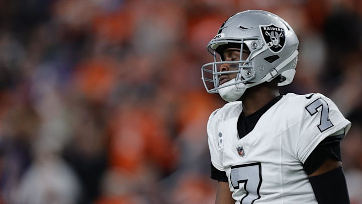 Nov 6, 2025; Denver, Colorado, USA; Las Vegas Raiders quarterback Geno Smith (7) reacts during the first half at Empower Field at Mile High. Mandatory Credit: Isaiah J. Downing-Imagn Images