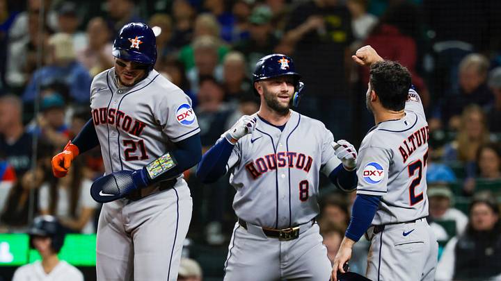 Sep 22, 2026; Seattle, Washington, USA; Houston Astros first baseman Christian Walker (8) celebrates with catcher Yainer Diaz (21) and second baseman Jose Altuve (27) after hitting a three-run home run against the Seattle Mariners during the third inning at T-Mobile Park. Diaz and Altuve each scored a run on the home run by Walker. Mandatory Credit: Joe Nicholson-Imagn Images