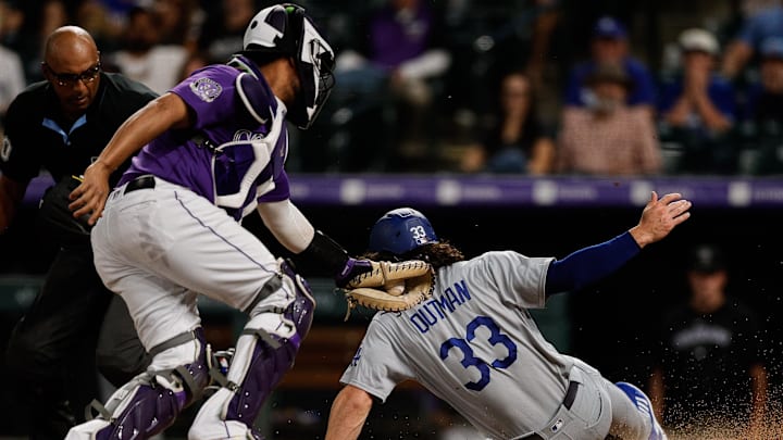 Sep 26, 2023; Denver, Colorado, USA; Los Angeles Dodgers center fielder James Outman (33) slides