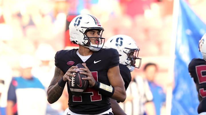 Oct 19, 2024; Stanford, California, USA; Stanford Cardinal quarterback Ashton Daniels (14) drops back to pass against the Southern Methodist Mustangs during the first quarter at Stanford Stadium. Mandatory Credit: Darren Yamashita-Imagn Images