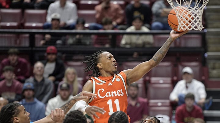 Feb 19, 2025; Tallahassee, Florida, USA; Miami Hurricanes guard AJ Staton-McCray (11) shoots the ball against the Florida State Seminoles during the first half at Donald L. Tucker Center. Mandatory Credit: Melina Myers-Imagn Images