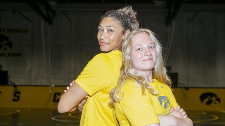 Kennedy Blades, left, and Macey Kilty stand for a portrait during Iowa women’s wrestling media day Tuesday, Oct. 15, 2024, in Iowa City, Iowa.