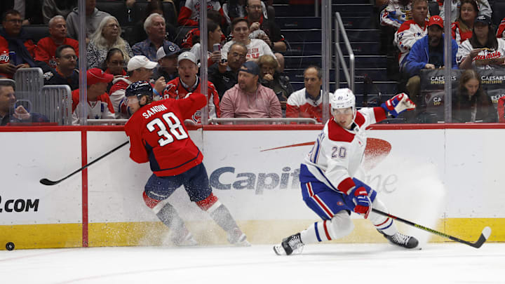 Oct 31, 2024; Washington, District of Columbia, USA; Washington Capitals defenseman Rasmus Sandin (38) controls the puck in front off Montreal Canadiens left wing Juraj Slafkovsky (20) in the second period at Capital One Arena. Mandatory Credit: Geoff Burke-Imagn Images