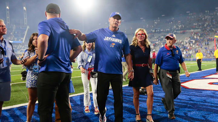Kansas Jayhawks head coach Lance Leipold exits the stadium with his wife, Kelly Leipold, after the game between Fresno State and Kansas at David Booth Kansas Memorial Stadium on Aug. 23, 2025.
