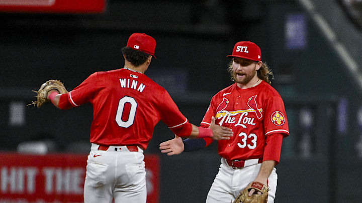 Jun 7, 2024; St. Louis, Missouri, USA;  St. Louis Cardinals second baseman Brendan Donovan (33)celebrates with shortstop Masyn Winn (0) after the Cardinals defeated the Colorado Rockies at Busch Stadium. Mandatory Credit: Jeff Curry-Imagn Images