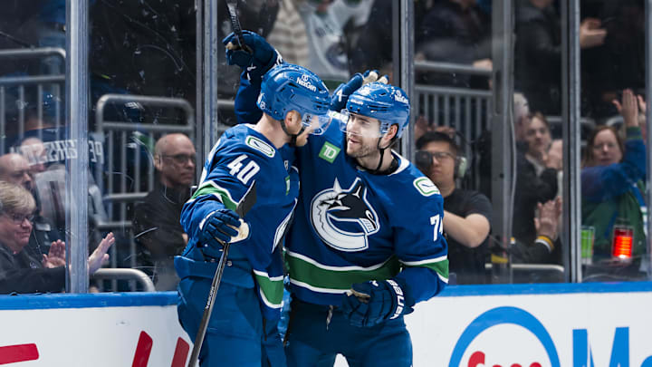Apr 14, 2026; Vancouver, British Columbia, CAN; Vancouver Canucks forward Elias Pettersson (40) and forward Jake DeBrusk (74) celebrate DeBrusk’s game-winning overtime goal at Rogers Arena. Mandatory Credit: Bob Frid-Imagn Images