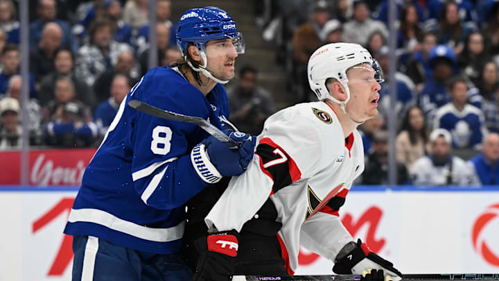 Apr 22, 2025; Toronto, Ontario, CAN;  Toronto Maple Leafs defenseman Chris Tanev (8) pushes Ottawa Senators forward Brady Tkachuk (7) away from his goal area in the second period in game two of the first round of the 2025 Stanley Cup Playoffs at Scotiabank Arena. Mandatory Credit: Dan Hamilton-Imagn Images