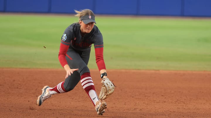 Stanford's River Mahler (1) fields the ball in the second inning of a Women's College World Series softball game between the Stanford Cardinal and the UCLA Bruins at Devon Park in Oklahoma City, Sunday, June 2, 2024. Stanford won 3-1.
