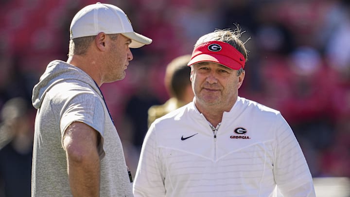 Nov 26, 2022; Athens, Georgia, USA; Georgia Bulldogs head coach Kirby Smart (right) talks to Georgia Tech Yellow Jackets interim head coach Brent Key prior to the game at Sanford Stadium. Mandatory Credit: Dale Zanine-Imagn Images