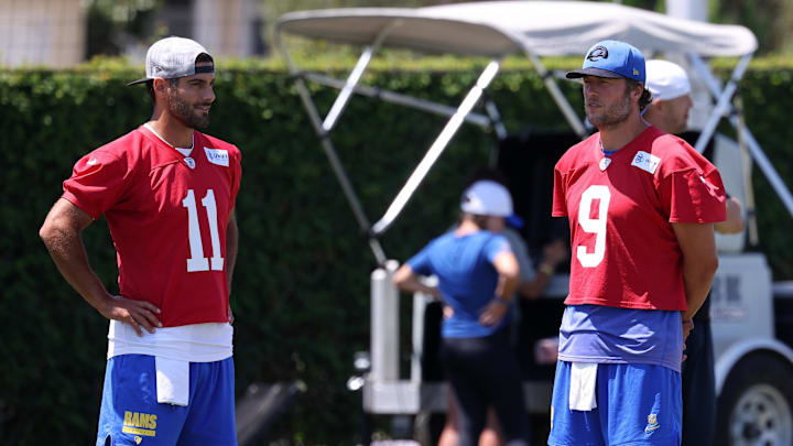 Jul 31, 2024; Los Angeles, CA, USA;  Los Angeles Rams quarterback Jimmy Garoppolo (11) and quarterback Matthew Stafford (9) talk during training camp at Loyola Marymount University. Mandatory Credit: Kiyoshi Mio-Imagn Images