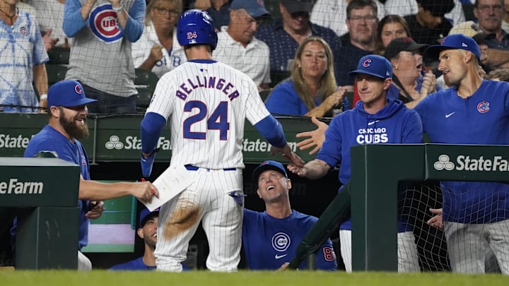 Sep 16, 2024; Chicago, Illinois, USA; Chicago Cubs outfielder Cody Bellinger (24) is greeted after scoring against the Oakland Athletics during the fourth inning at Wrigley Field. Mandatory Credit: David Banks-Imagn Images