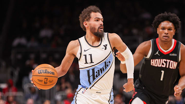 Jan 28, 2025; Atlanta, Georgia, USA; Atlanta Hawks guard Trae Young (11) is defended by Houston Rockets forward Amen Thompson (1) in the first quarter at State Farm Arena. Mandatory Credit: Brett Davis-Imagn Images Jan 28, 2025; Atlanta, Georgia, USA; Atlanta Hawks guard Trae Young (11) is defended by Houston Rockets forward Amen Thompson (1) in the first quarter at State Farm Arena. Mandatory Credit: Brett Davis-Imagn Images