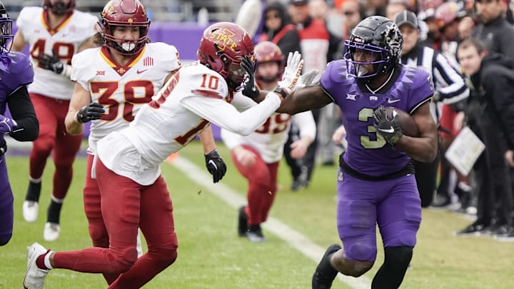TCU Horned Frogs running back Emari Demercado is knocked out of bounds by Iowa State Cyclones defensive back Darien Porter