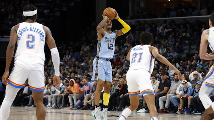 Dec 7, 2022; Memphis, Tennessee, USA; Memphis Grizzlies guard Ja Morant (12) shoots for three during the second halfagainst the Oklahoma City Thunder at FedExForum. Mandatory Credit: Petre Thomas-Imagn Images