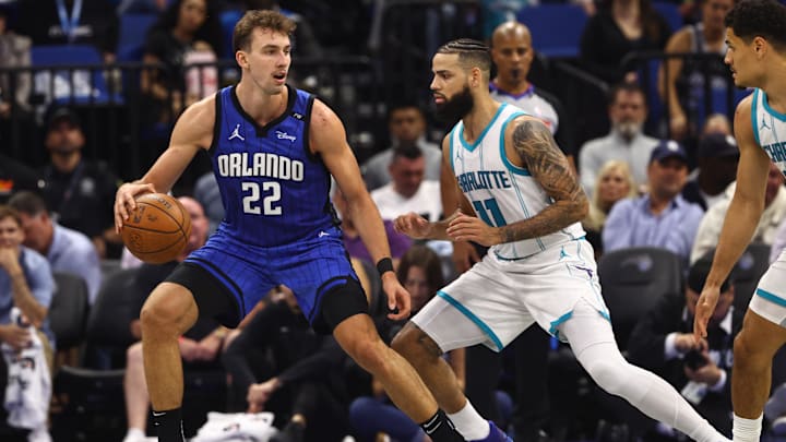 Orlando Magic forward Franz Wagner (22) drives to the basket as Charlotte Hornets forward Cody Martin (11) defends during the second quarter at Kia Center. Orlando Magic forward Franz Wagner (22) drives to the basket as Charlotte Hornets forward Cody Martin (11) defends during the second quarter at Kia Center.