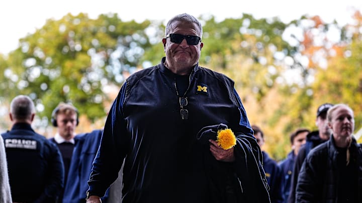 Michigan associate head coach Biff Poggi arrives at Spartan Stadium in East Lansing on Saturday, October 24, 2025.