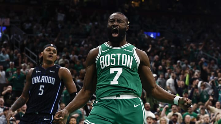 Apr 23, 2025; Boston, Massachusetts, USA; Boston Celtics guard Jaylen Brown (7) shouts out after dunking as Orlando Magic forward Paolo Banchero (5) turns away during the second half of game two of the first round of the 2024 NBA Playoffs at TD Garden. Mandatory Credit: Winslow Townson-Imagn Images